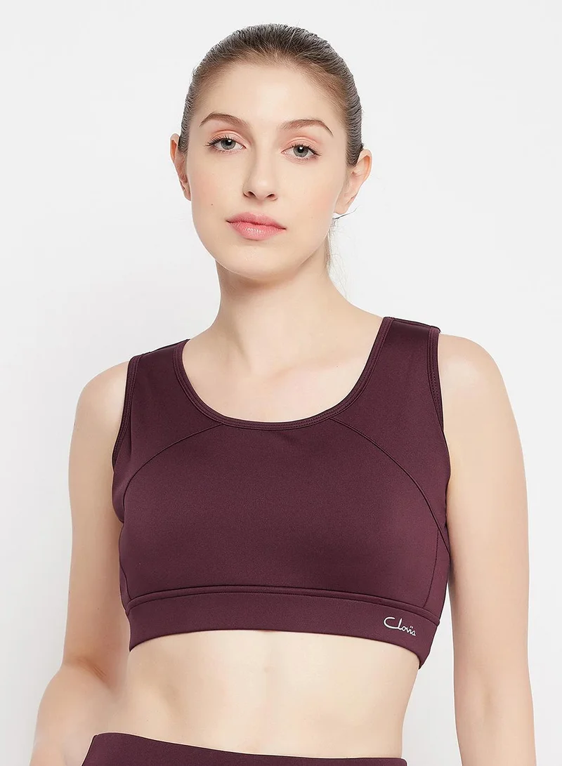 Clovia Red Medium Impact Padded Racerback Sports Bra in Maroon for Women | Best Price UAE